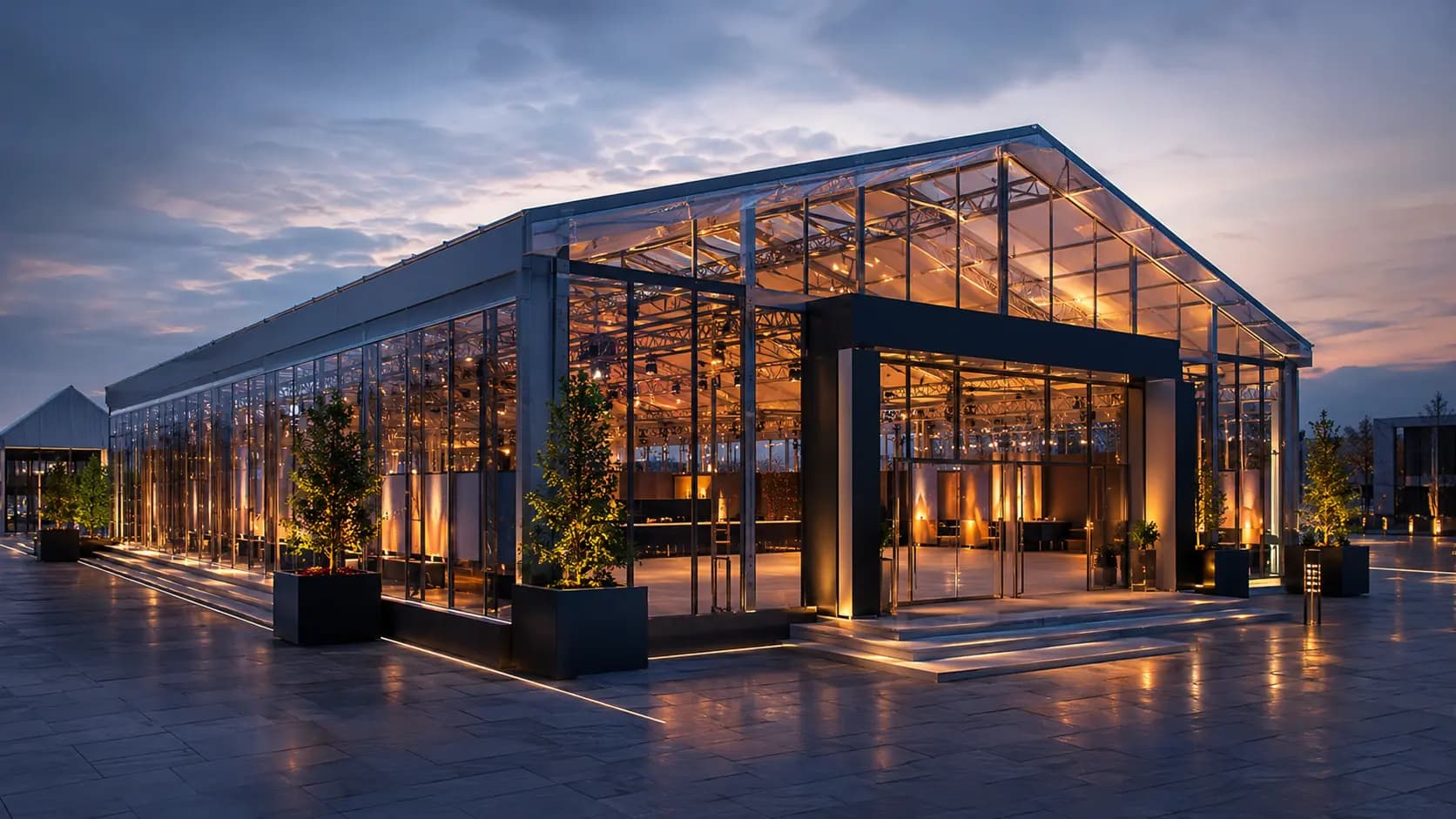 Glass event pavilion lit at dusk for exhibitions and functions – available in Bangalore, Chennai, Hyderabad, Mumbai, Pune, Delhi NCR & pan-India