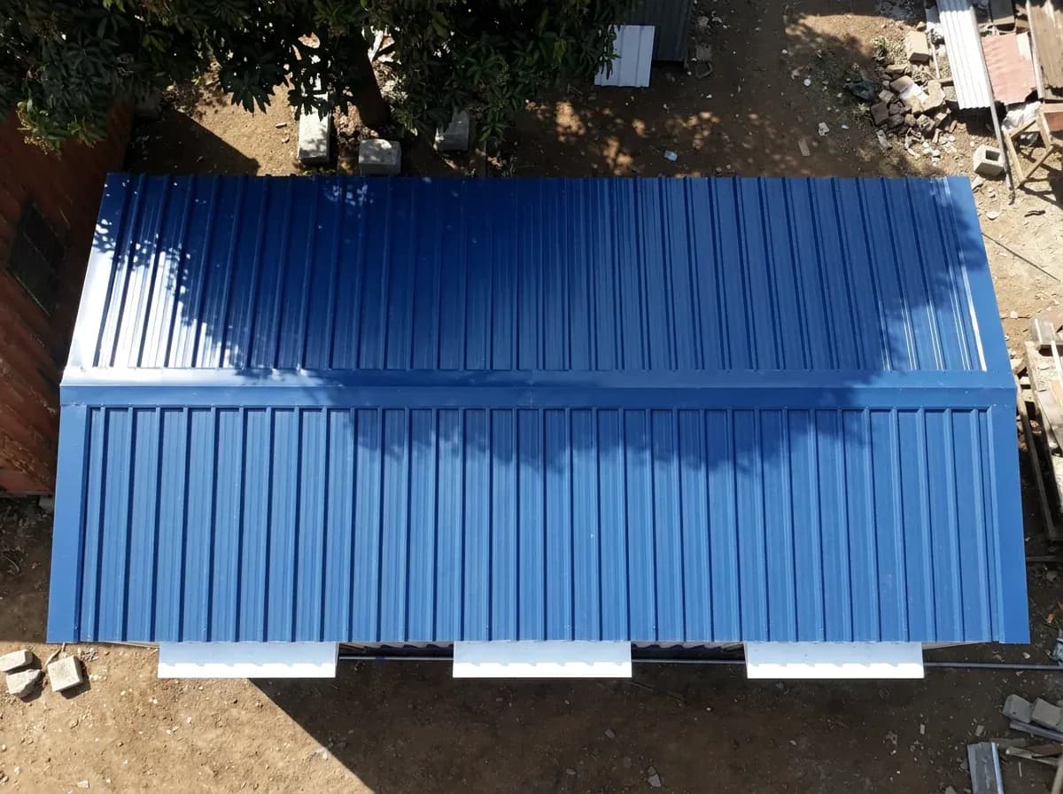 Illustrative example of a container office cabin seen from above, showing its blue profiled roof sheets