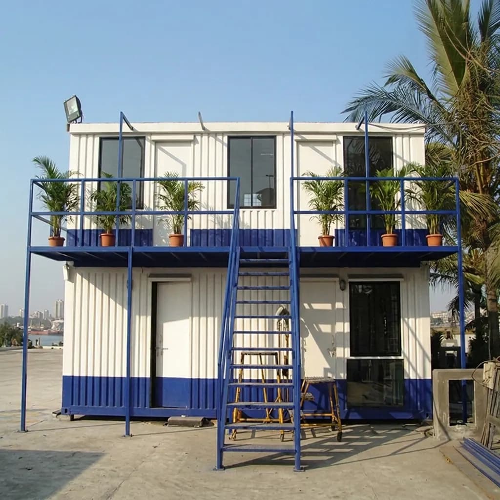 Front elevation of a double-storey container office for Doddaballapura — balcony walkway with railing, full-height windows and lockable entrance doors