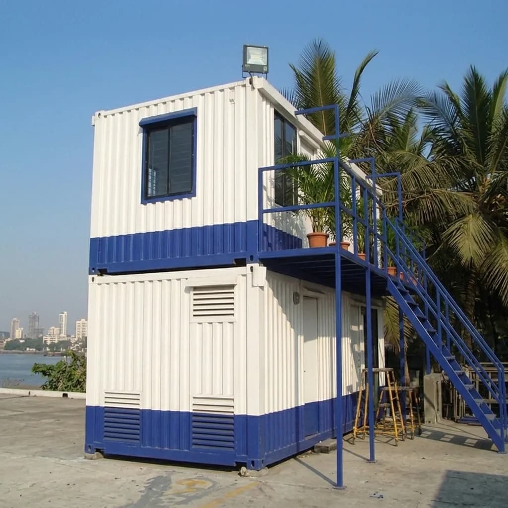 Container office in Doddaballapura — double-storey stacked portable container office with steel access staircase and upper-floor windows by Portable Office Cabin