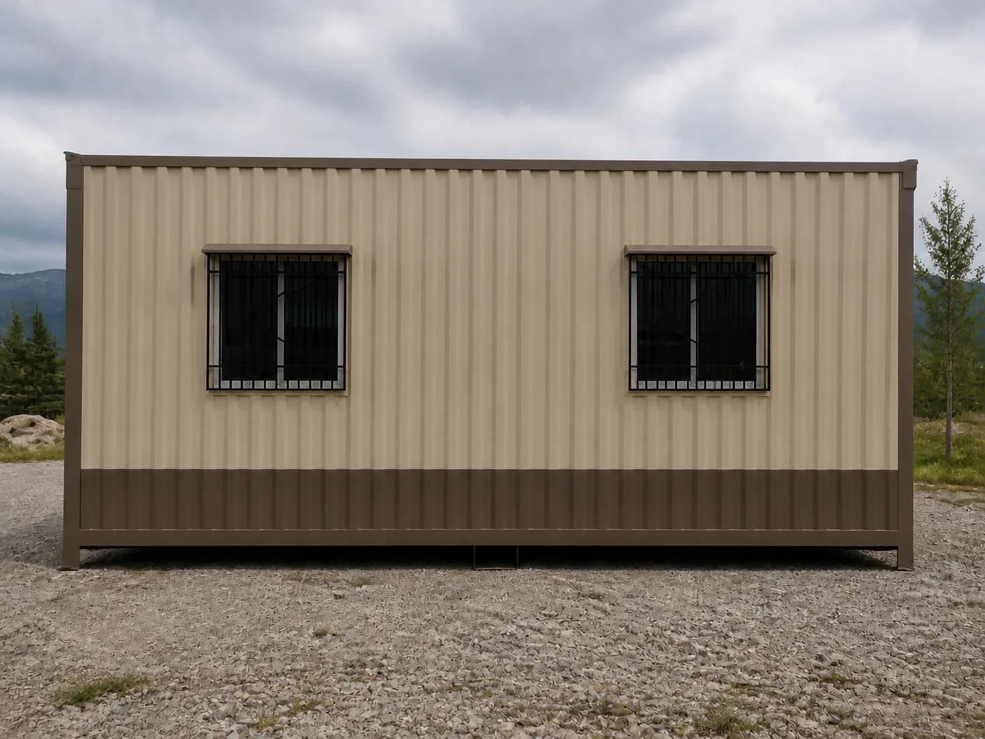 Portable cabin in Gummidipoondi — illustrative side elevation of the beige container-style cabin showing two grilled windows under brown hoods, the brown frame and lower band, on a gravel yard