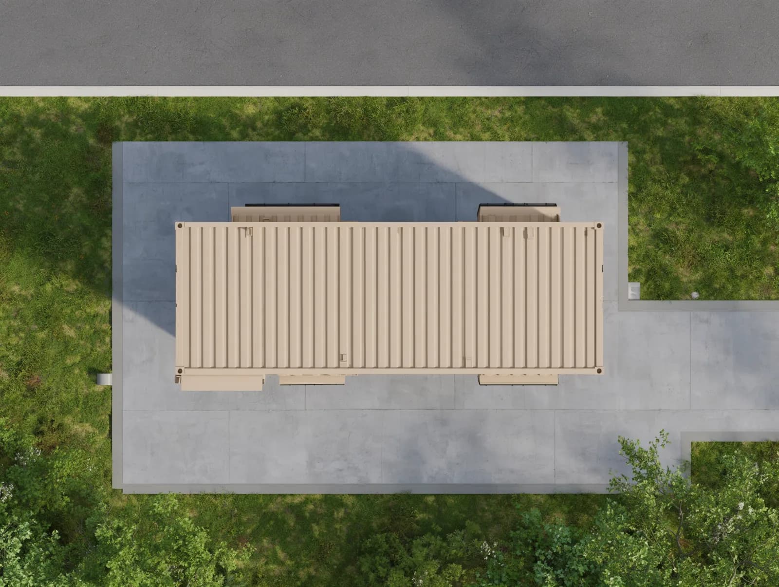 Portable cabins in Krishnagiri Industrial Area — illustrative plan-view render of the container-style cabin from above, showing the beige corrugated roof, the door canopy and the window hoods, on a paved apron beside a lawn and a road